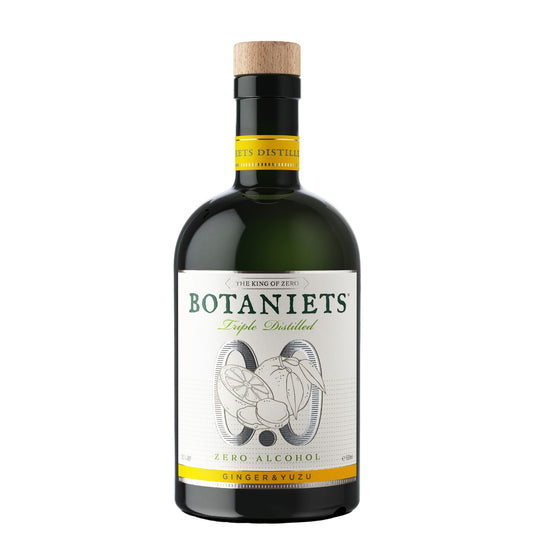 A bottle of Botaniets Triple Distilled Zero Alcohol Ginger yuzu drink, featuring a dark green glass bottle with a light wood cork stopper and a white label with green and yellow accents.