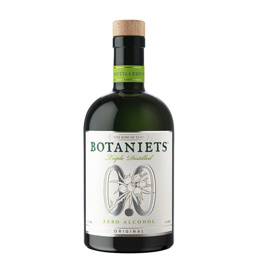 A bottle of Botaniets Triple Distilled Zero Alcohol Original gin with a dark green glass body, a white label with green and black text, and a natural cork stopper, shown on a plain white background.