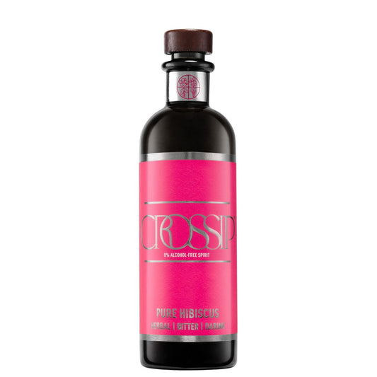 A bottle of CROSSIP Pure Hibiscus 100% alcohol-free spirit, featuring a vibrant pink label with silver lettering and a dark brown cap, set against a plain white background.