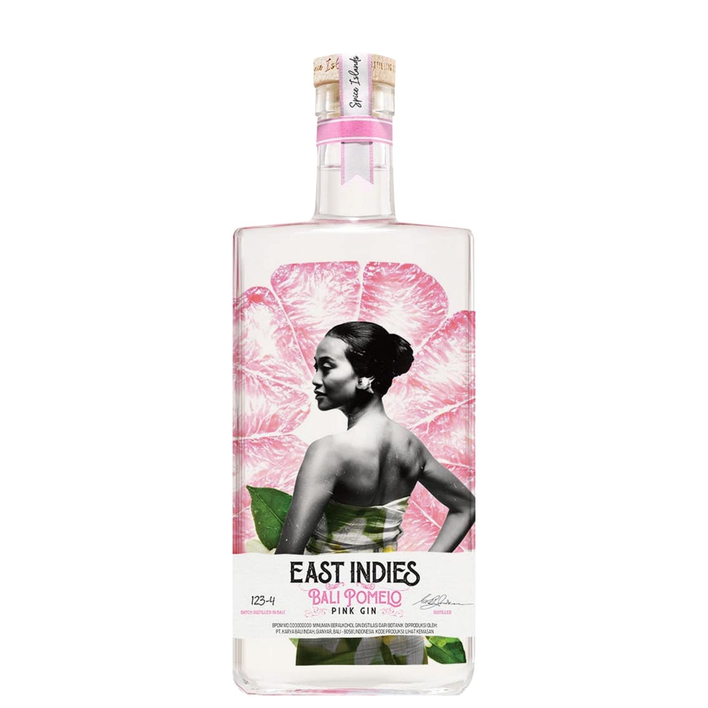 A bottle of East Indies Bali Romero Pink Gin on a solid white background. The clear glass bottle features a label with a large pink flower, a black-and-white portrait of a woman, and green leaves, topped with a gold seal.