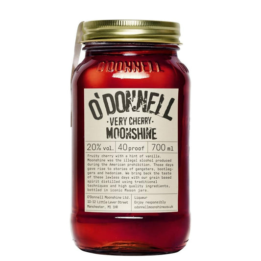 A glass jar of O'Donnell Very Cherry Moonshine liqueur with a gold metal lid and a cream-colored label, shown against a plain white background.