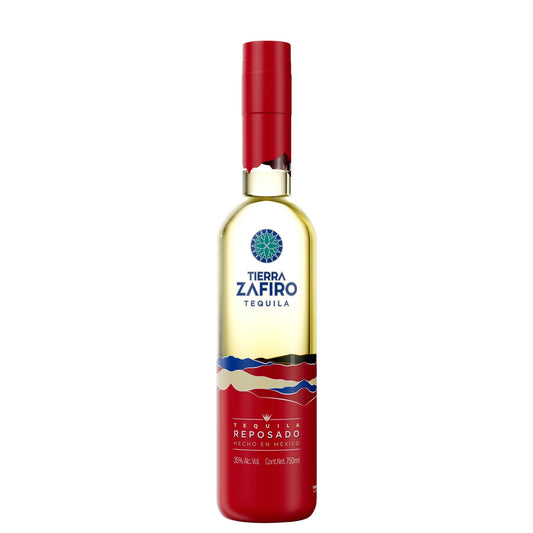 A bottle of Tierra Zafiro Reposado Tequila on a solid white background, featuring a red cap and a red lower label with blue and white accents.