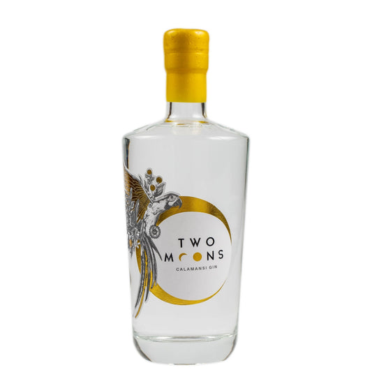 A bottle of Two Moons Calamansi Gin with a clear glass body, a bright yellow cap, and a white label featuring a gold crescent moon and a silver bird illustration.