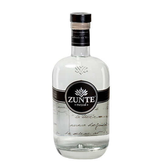 A bottle of Zunte Mescal tequila on a solid white background, featuring a clear glass bottle with a black and white label.