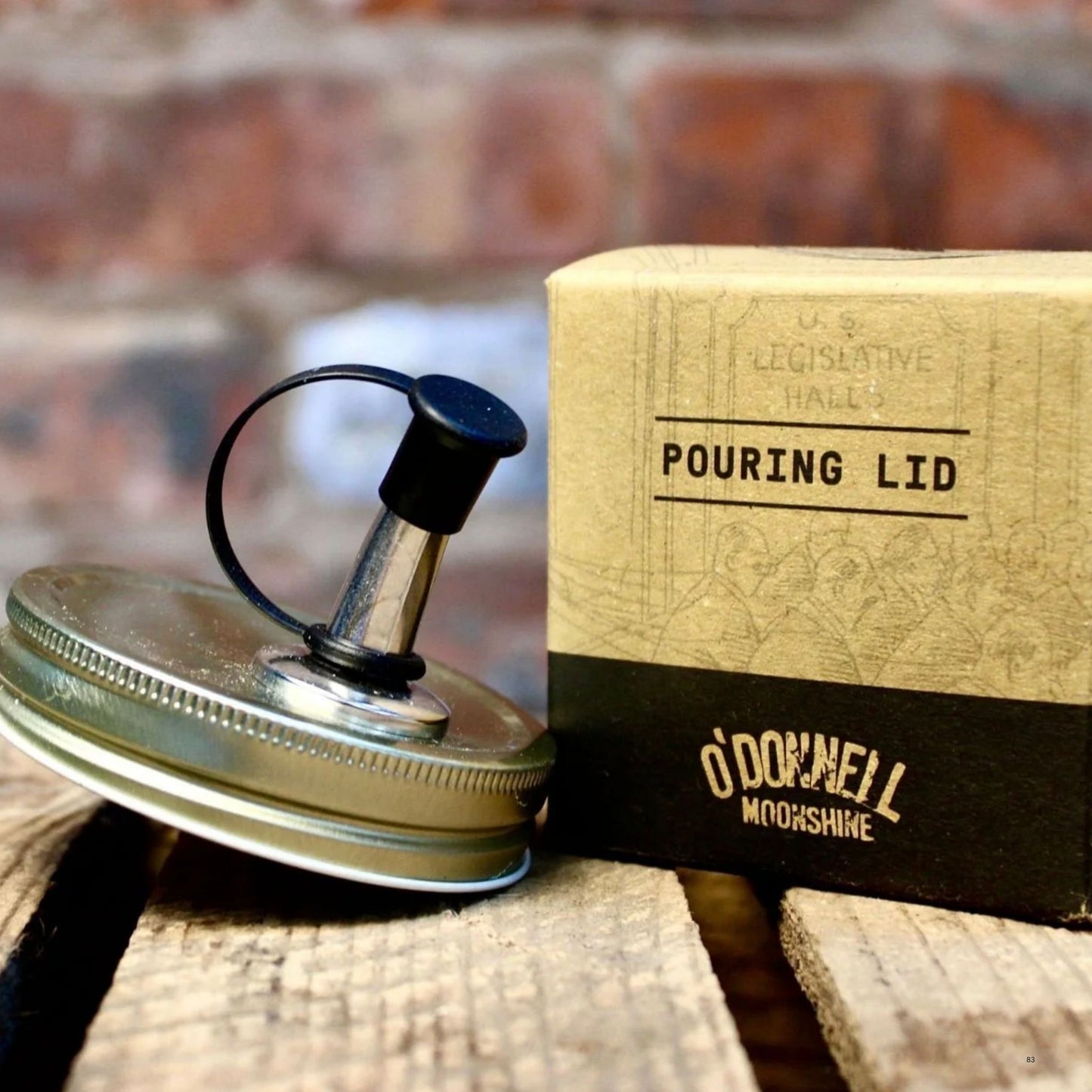 pouring lid for O’Donnell moonshine next to a its packaging.