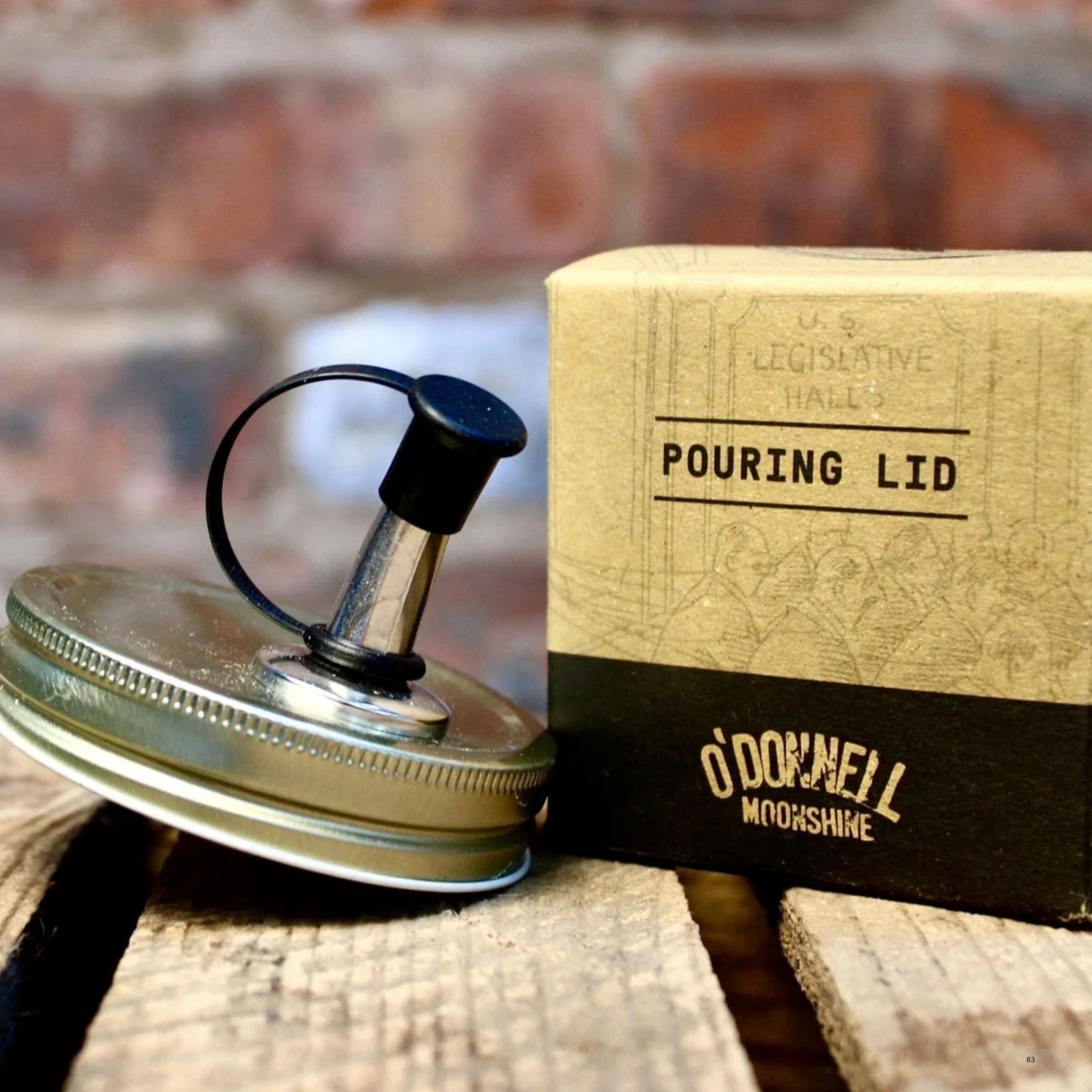 pouring lid for O’Donnell moonshine next to a its packaging.